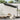 Cantilever square garden parasol with dark canopy and solar LED string lights on ribs