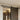 Black sliding barn door track and rollers on a wall-mounted doorway