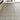Wood-effect vinyl floor tiles in light beige herringbone pattern, peel-and-stick
