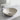 Round ceramic vessel sink with pop-up drain stopper and chrome faucet