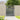 Gray wooden garden gate, vertical slats with top and mid rails, square posts