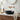 Matte black round ceramic vessel sink basin with drain opening and wall faucet taps