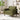 Green corduroy accent armchair with rolled arms, seat cushion, and tapered wooden legs