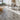 Light gray wood-effect peel-and-stick PVC plank flooring tiles in a room