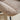 Close-up light brown chenille cushion with stitched trim on the arm