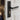 Black door lock cylinder with keyhole and lever handle on door