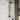 Black shower system with round rainfall head and handheld shower mixer