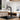 Black pull-out kitchen faucet with chrome sprayer in sink