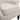 Beige armchair close-up of curved seat cushion and upholstered arm with studded edging