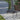 Black cantilever parasol round weighted base and vertical pole